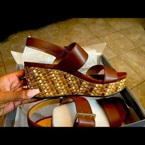 Gorgeous pair of wedge new direction sandals great for nude whites and pastels!